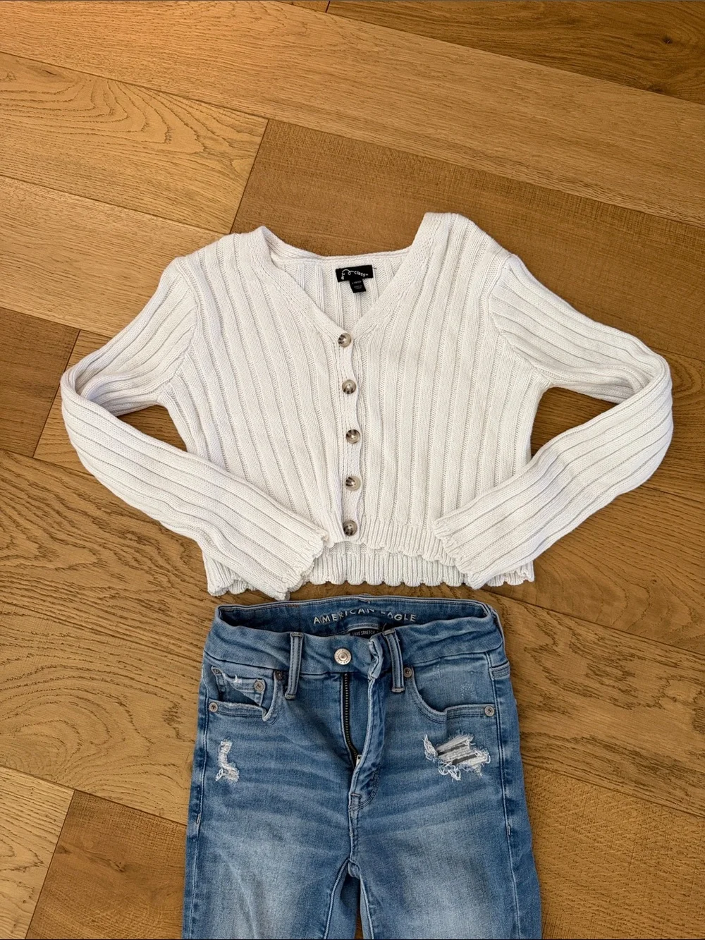 American Eagle Outfitters Skinny Jeans Paired with Button Down Sweater